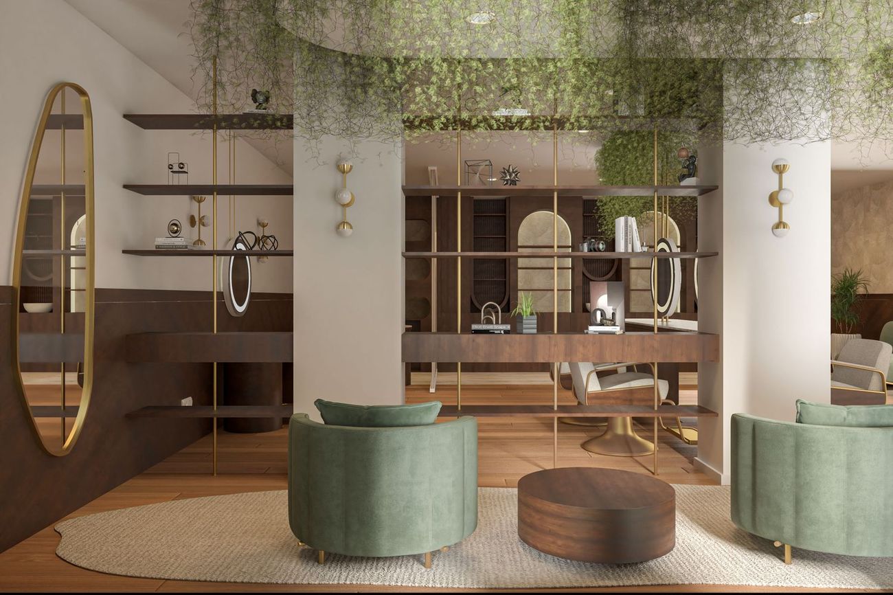 Salón de hotel con sillones de terciopelo verde y estanterías